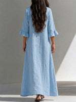 Long Dress Featuring A Partial Button-front, Gathered Details, Ruffled Three-quarter Sleeves, And A Flattering, Figure-concealing Fit
