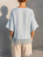 Solid-color Washed Linen Loose-fit Top Featuring A Round Neck, Ruffled Mid-length Sleeves, And A Tassel Hem—designed For A Relaxed, Flattering Fit
